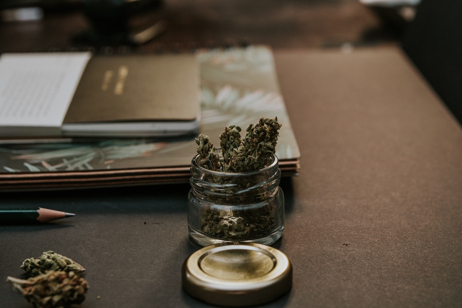 Jar of marijuana on desk